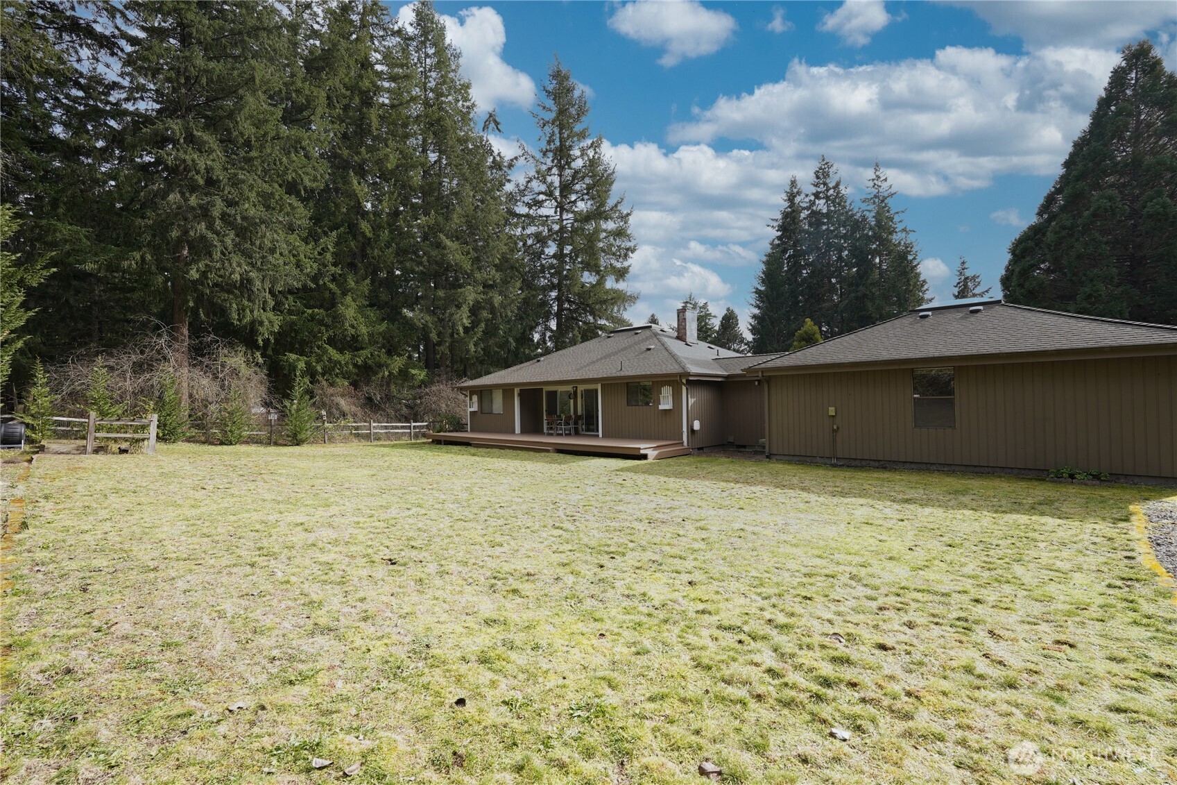 6511 255th St Court East Graham, WA 98338 - Photo 18 of 20 a backyard of a house with lots of green space
