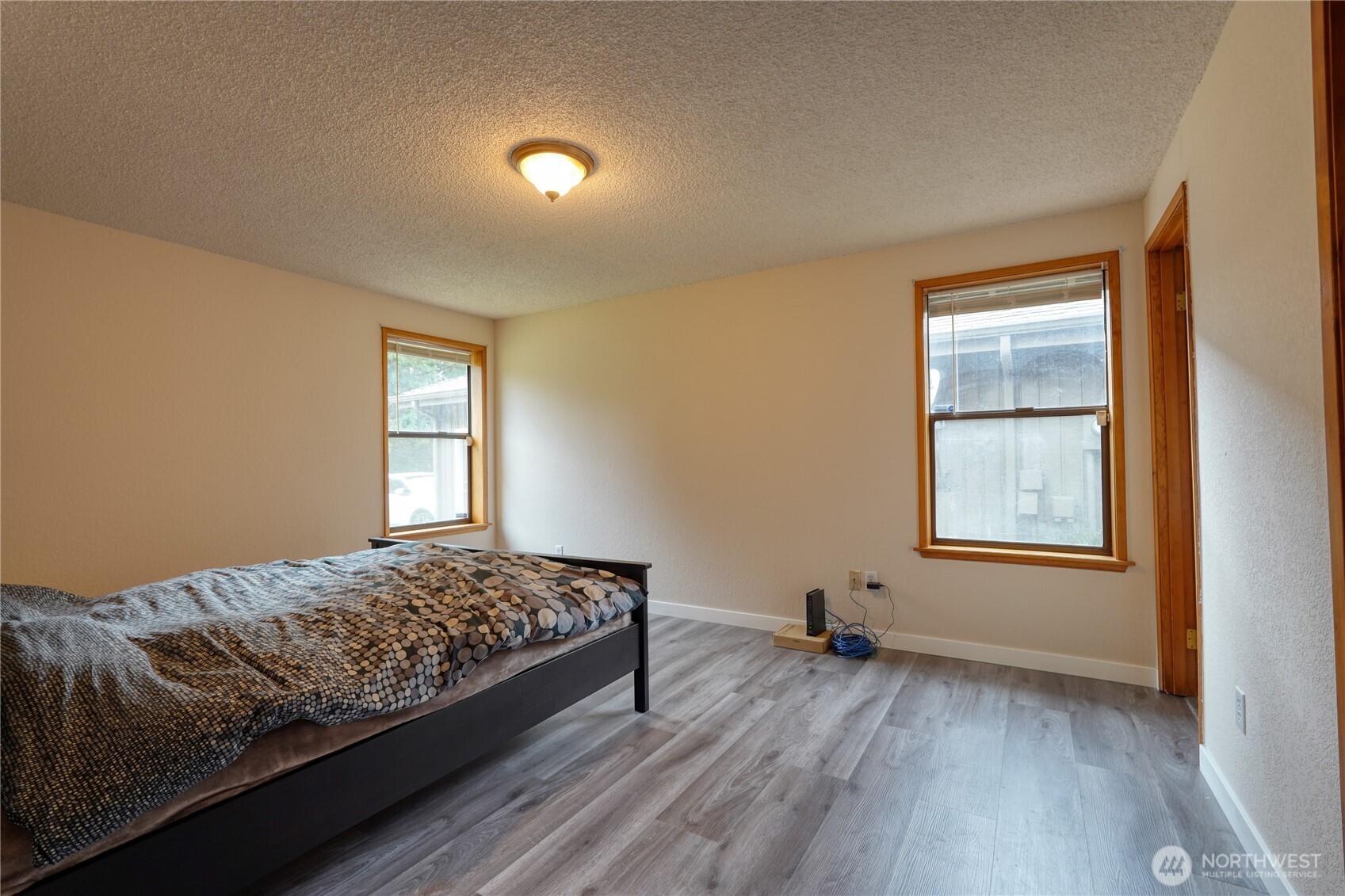 6511 255th St Court East Graham, WA 98338 - Photo 10 of 20 a bedroom with a bed and a window