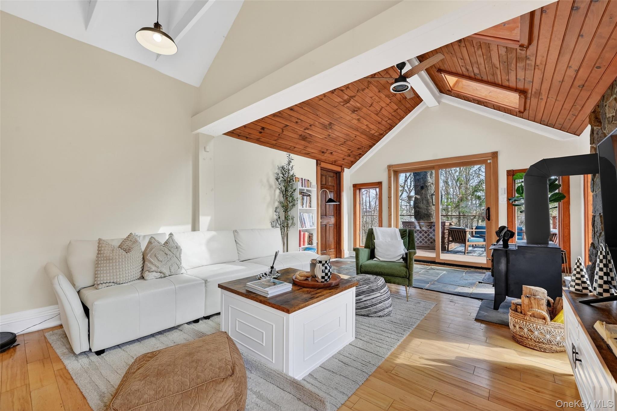 96 Lower Wisner Road Warwick, NY 10990 - Photo 13 of 34 Vaulted wood-paneled ceilings with exposed beams and a skylight define this living space