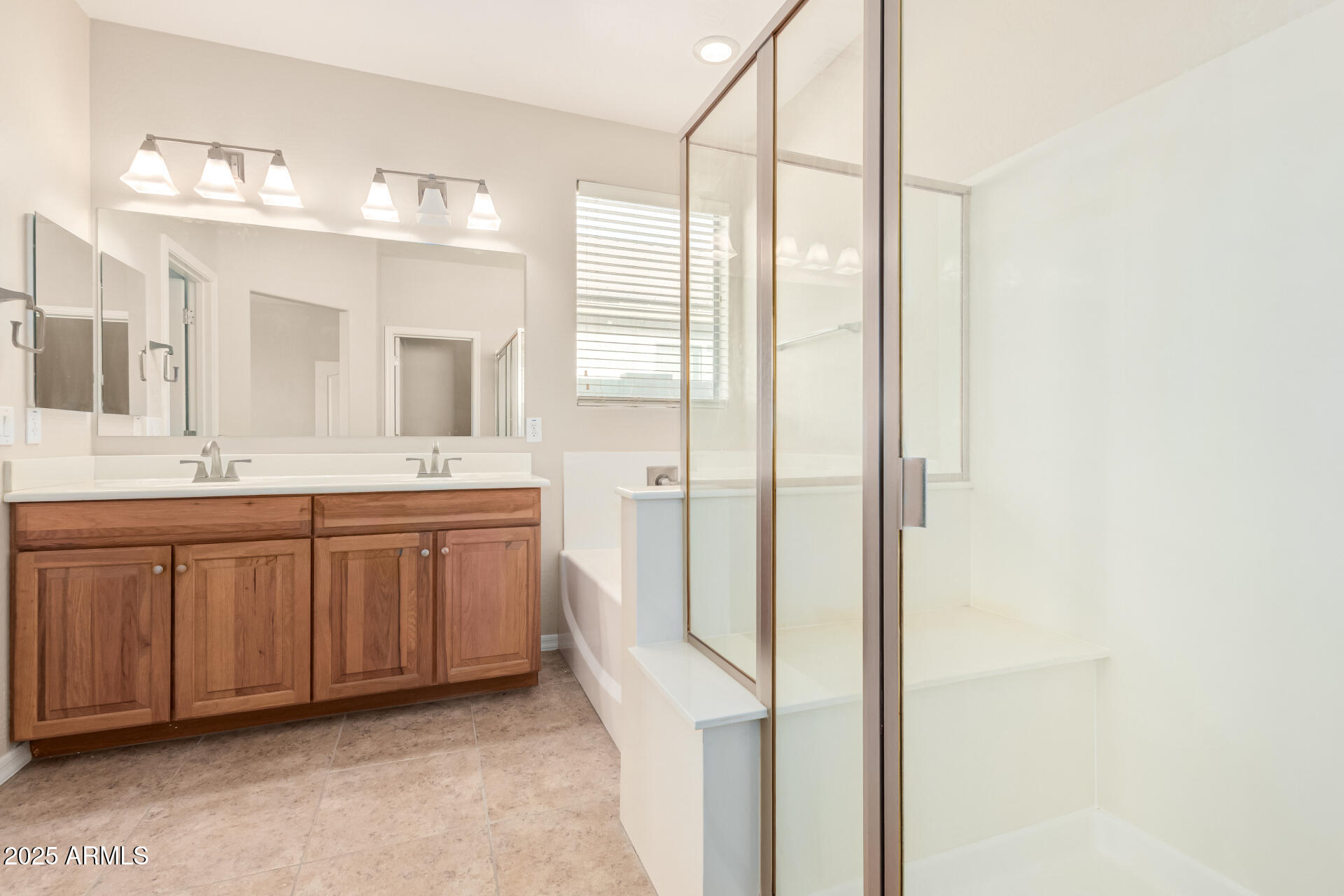 2530 West Gaby Road Phoenix, AZ 85041 - Photo 12 of 30 a bathroom with a double vanity sink mirror and