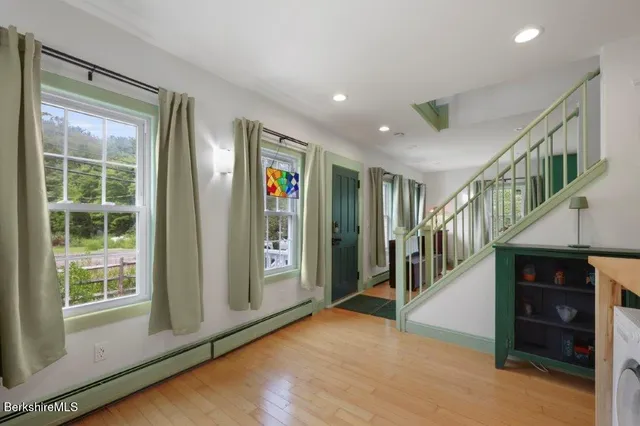 a view of an entryway with front door