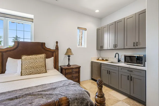 a bedroom with a bed and a dresser