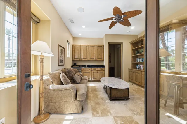 a view of a swimming pool with a garden and plants