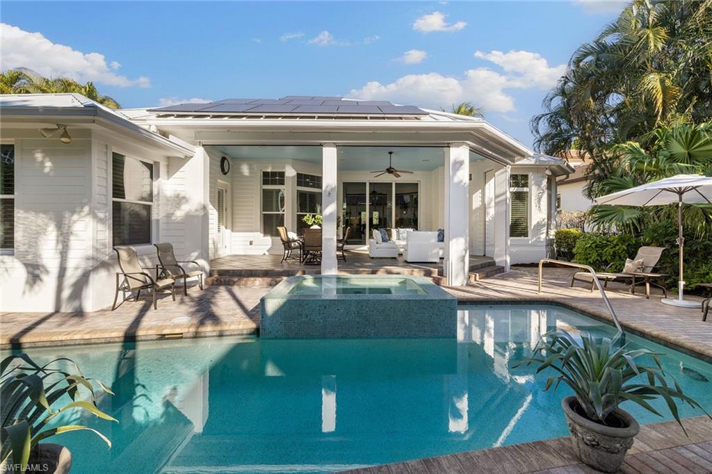 642 Bougainvillea Road Naples, FL 34102 - Photo 22 of 50 View of swimming pool with a ceiling fan, a patio, an outdoor hangout area, outdoor dining area, and a pool with connected hot tub