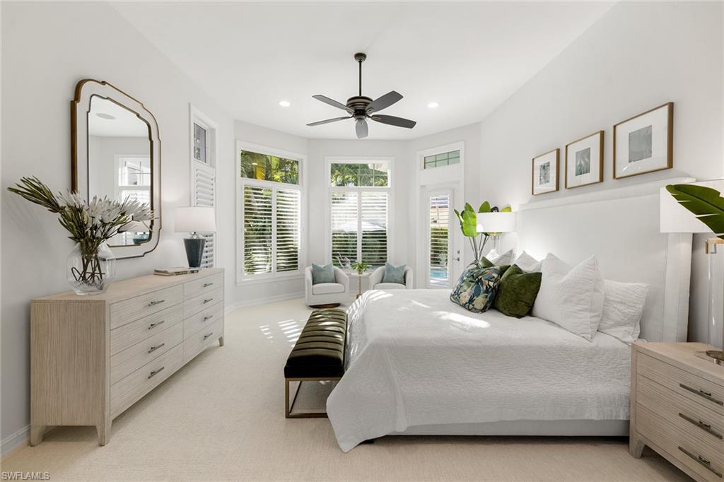 642 Bougainvillea Road Naples, FL 34102 - Photo 25 of 50 Bedroom with light colored carpet and recessed lighting