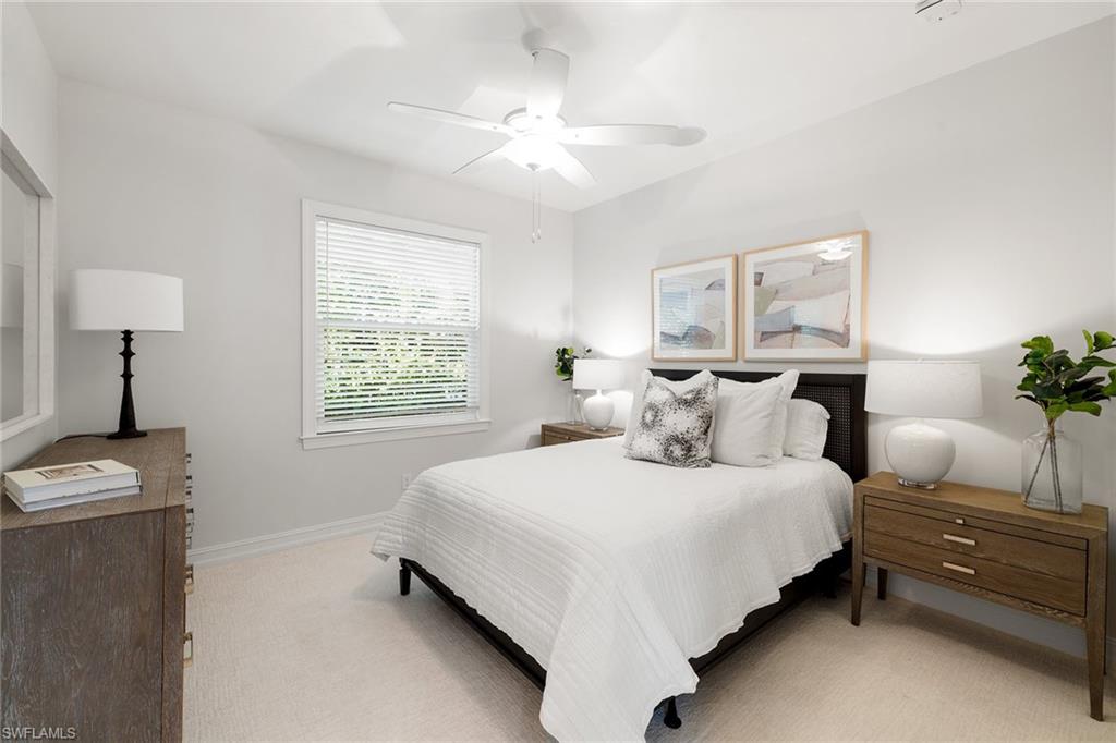 642 Bougainvillea Road Naples, FL 34102 - Photo 33 of 50 Bedroom featuring light colored carpet and ceiling fan