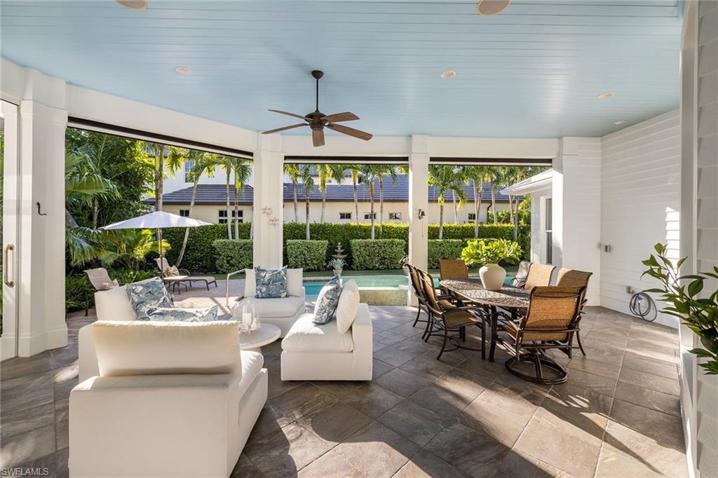 642 Bougainvillea Road Naples, FL 34102 - Photo 41 of 50 Sunroom / solarium featuring healthy amount of natural light and wood ceiling