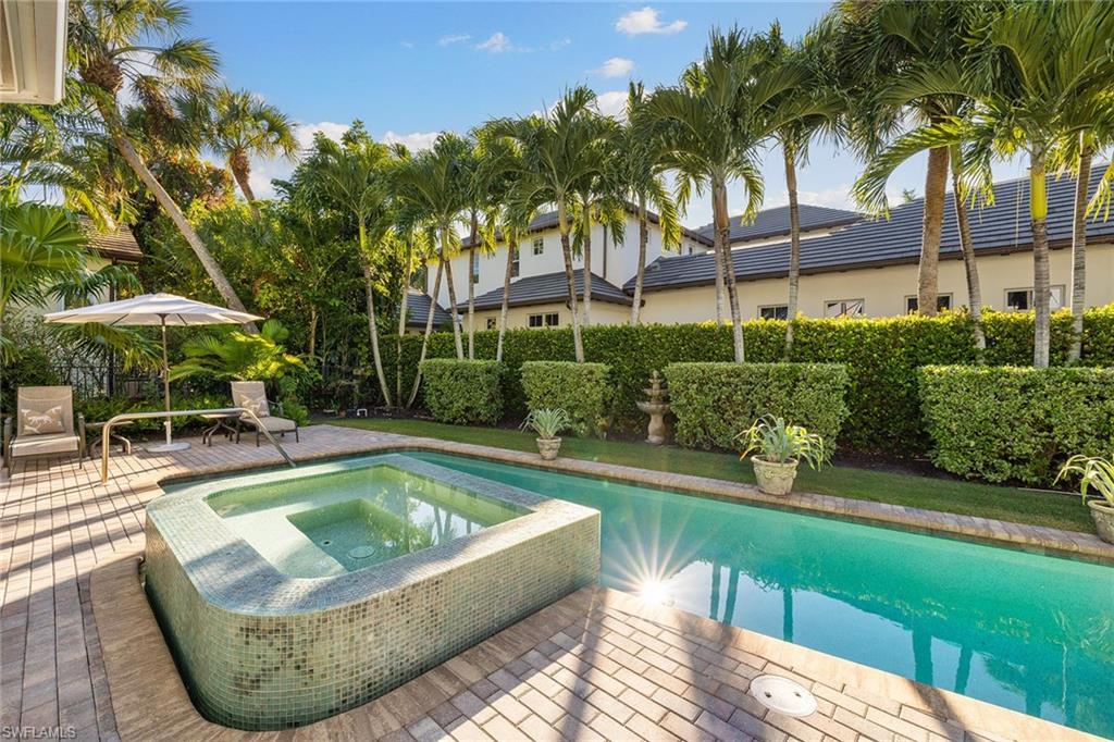 642 Bougainvillea Road Naples, FL 34102 - Photo 44 of 50 View of swimming pool with an in-ground hot tub and a patio