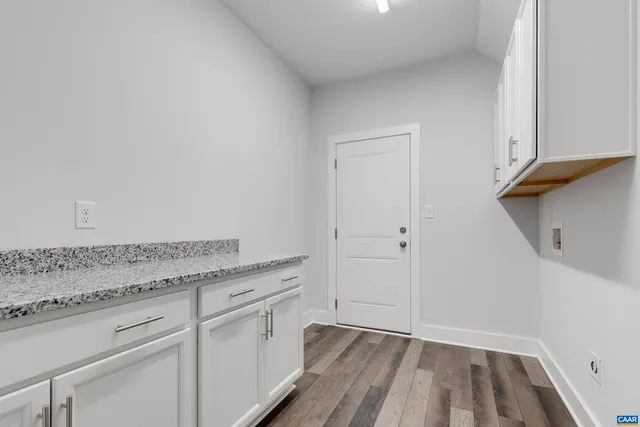a view of a storage and utility room with closet