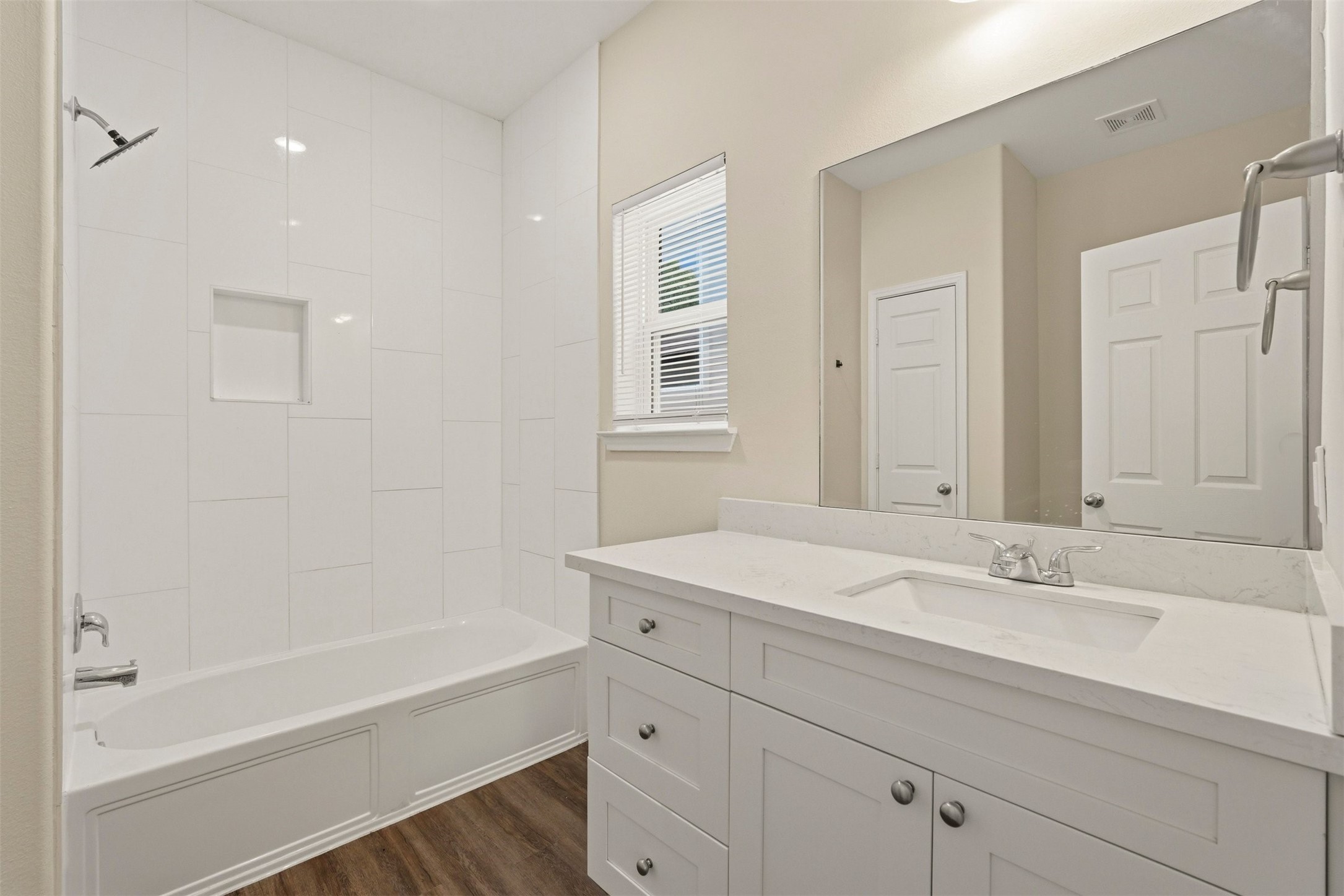 2218 Bringhurst Street, Unit B Houston, TX 77026 - Photo 23 of 25 a bathroom with a sink double vanity granite tub and shower