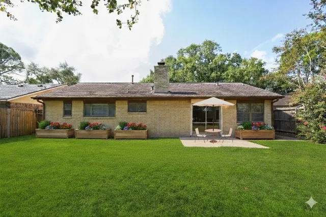 a view of a house with a yard porch and sitting area