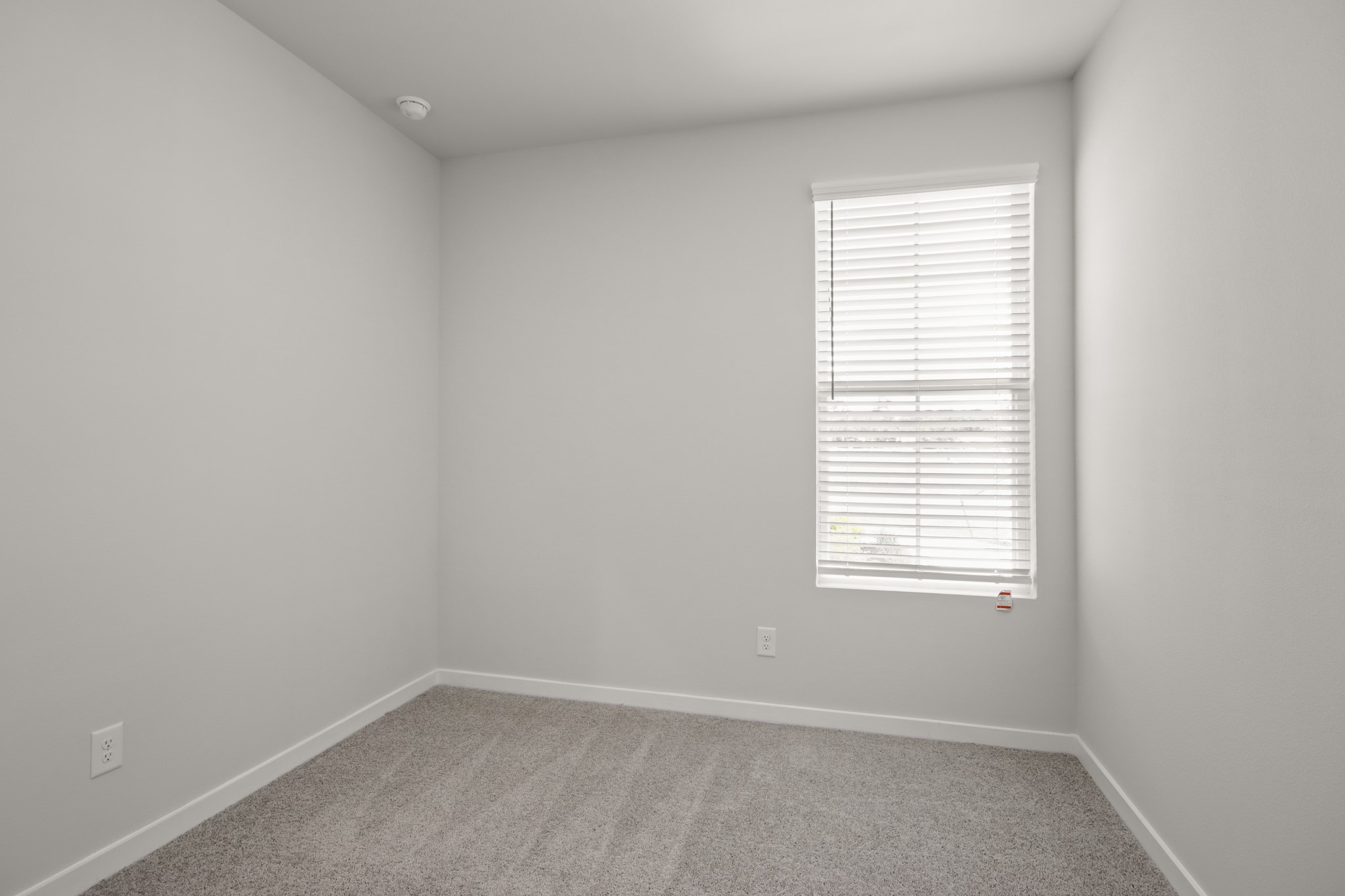 17859 Lionheart Road Conroe, TX 77306 - Photo 14 of 23 an empty room with a window