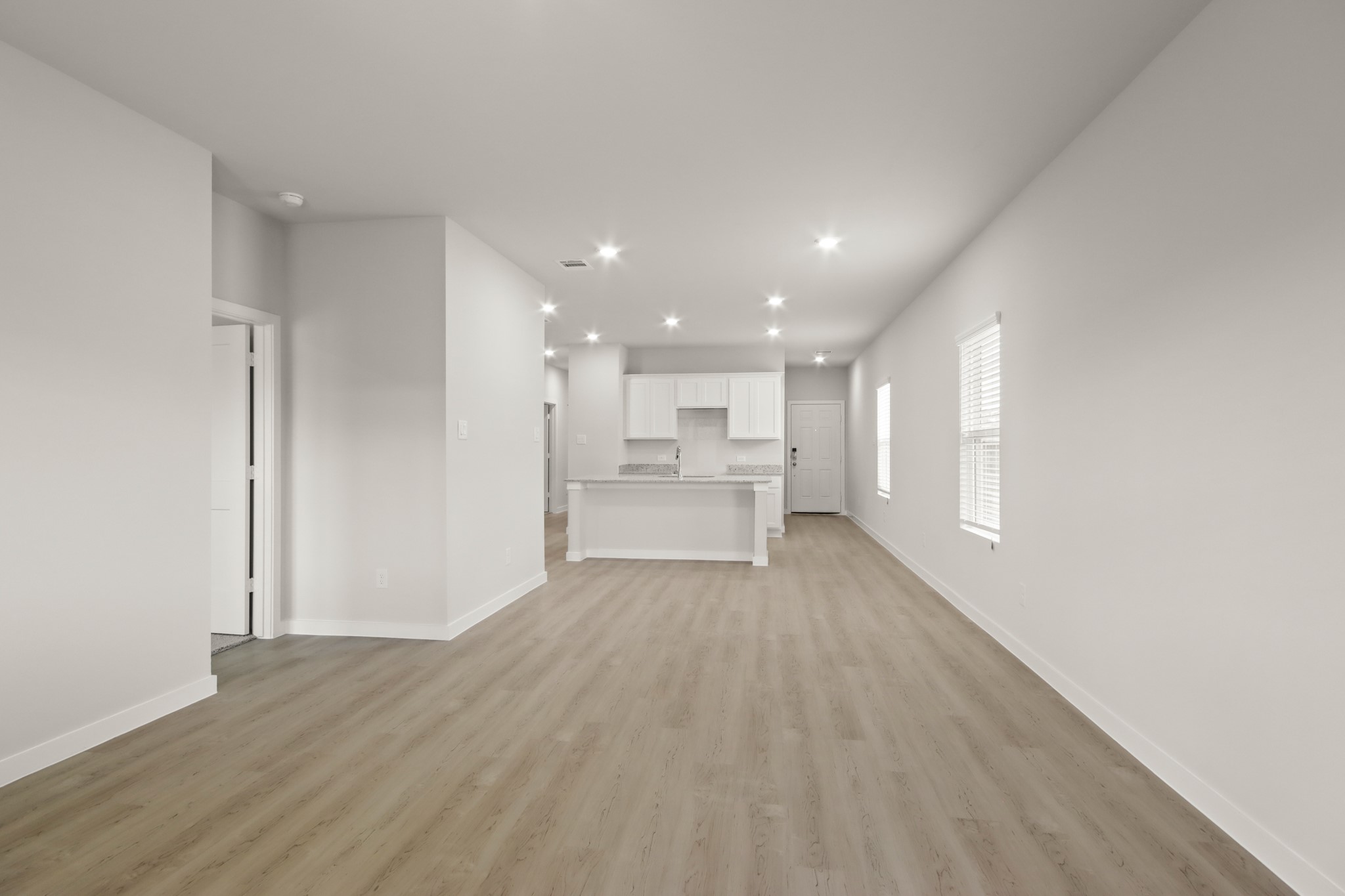 17859 Lionheart Road Conroe, TX 77306 - Photo 5 of 23 a view of a big room with wooden floor and windows