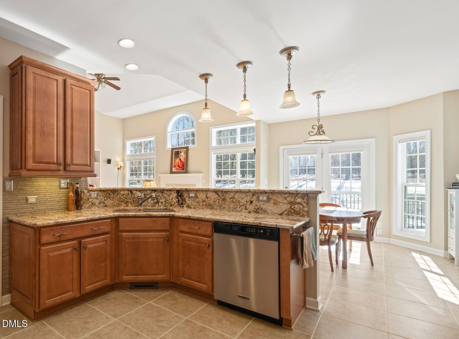 1009 Hidden River Court Raleigh, NC 27614 - Photo 11 of 40 a kitchen with a sink stove and cabinets