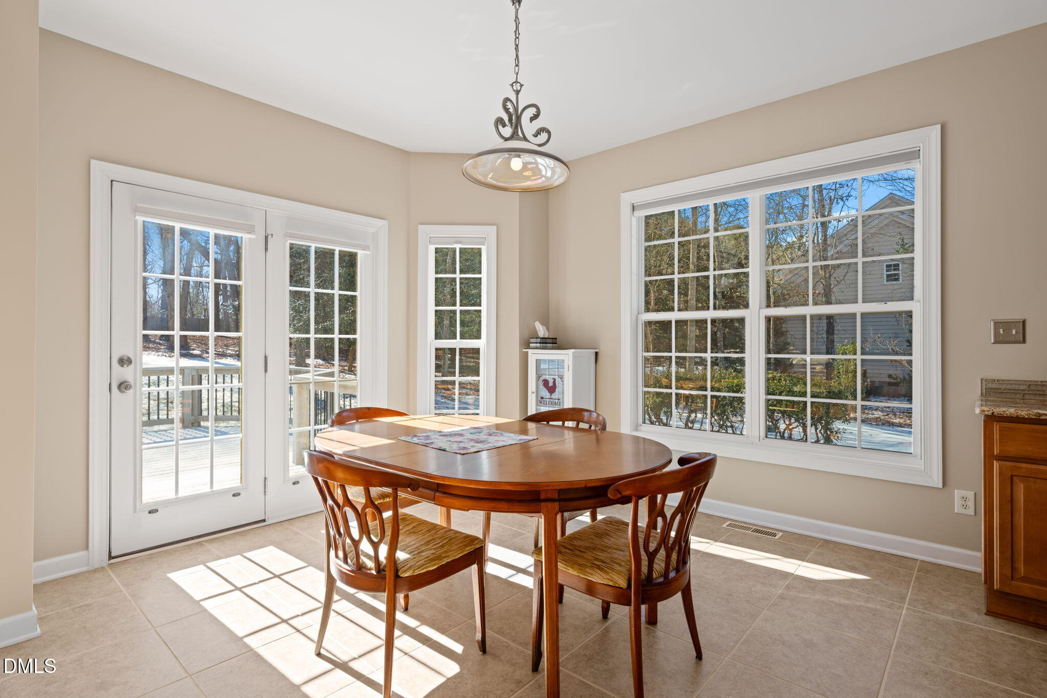 1009 Hidden River Court Raleigh, NC 27614 - Photo 12 of 40 a dining room with furniture front door and wooden floor
