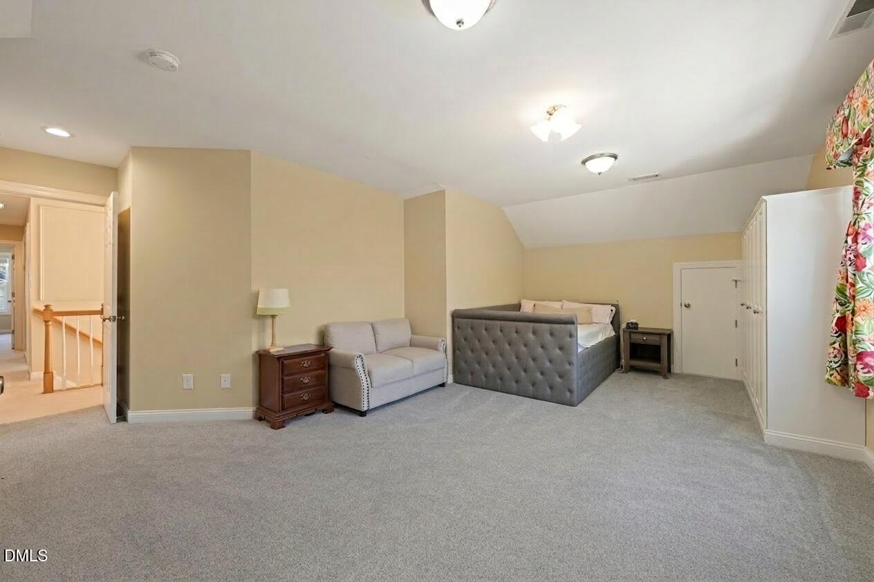 1009 Hidden River Court Raleigh, NC 27614 - Photo 22 of 40 a living room with furniture and a walk in closet