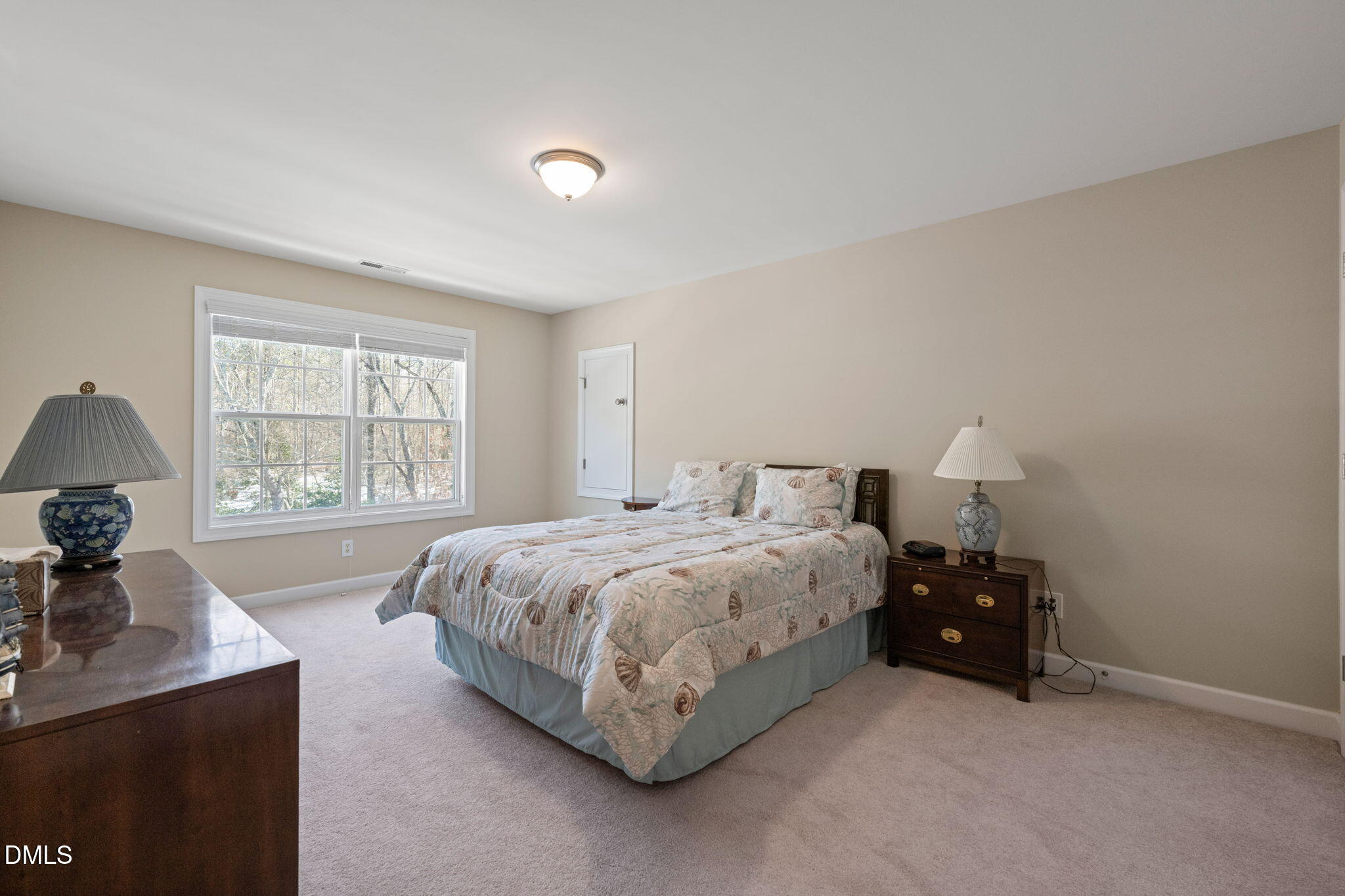 1009 Hidden River Court Raleigh, NC 27614 - Photo 25 of 40 a spacious bedroom with a bed and a window