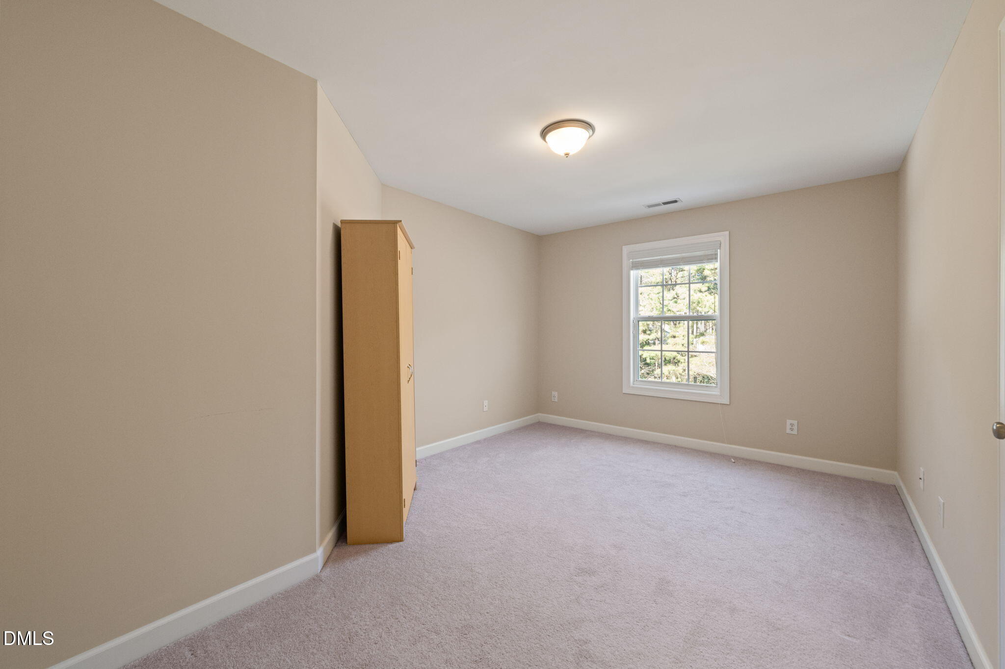 1009 Hidden River Court Raleigh, NC 27614 - Photo 27 of 40 an empty room with a window