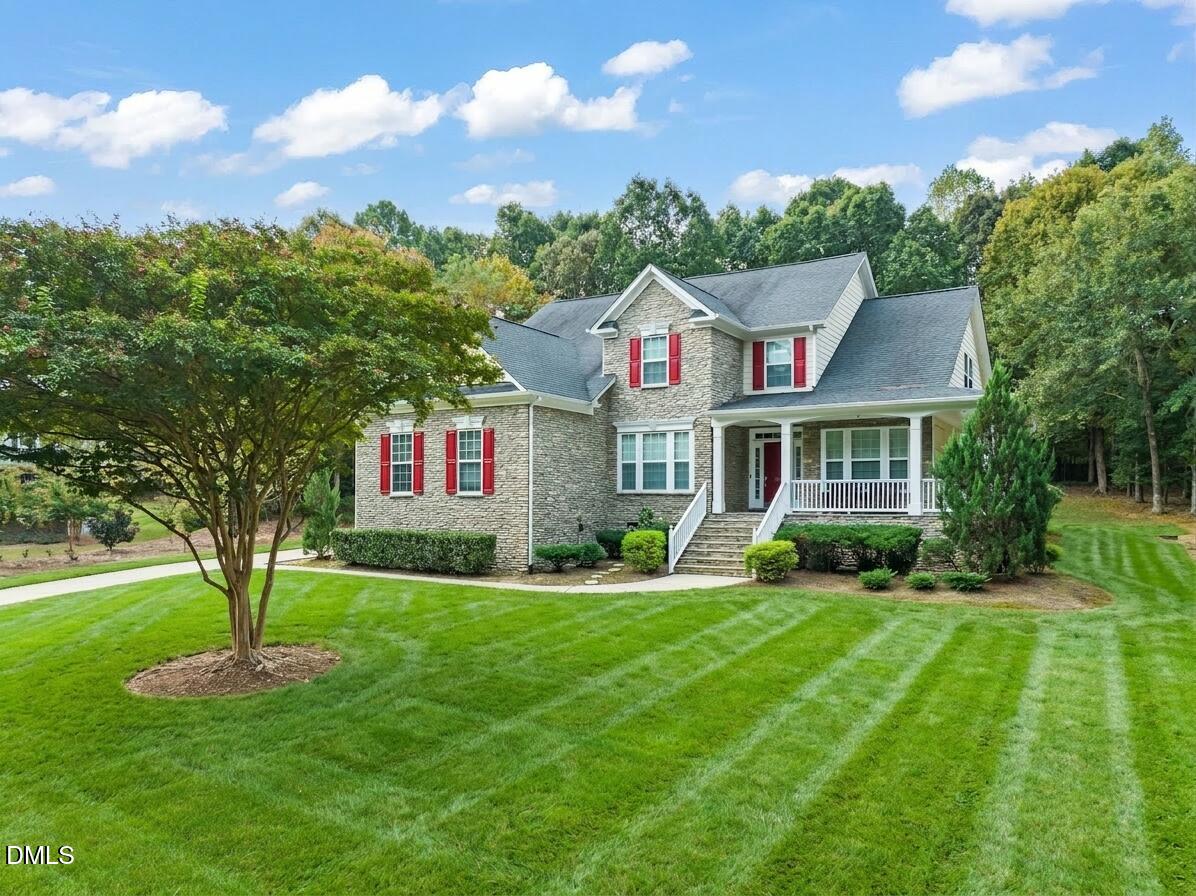 1009 Hidden River Court Raleigh, NC 27614 - Photo 36 of 40 a front view of a house with a yard