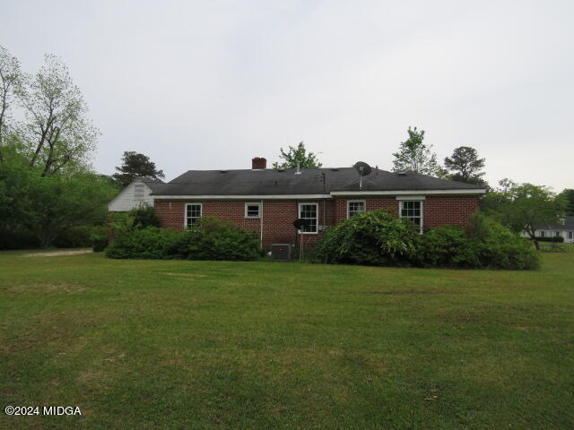 7367 Columbus Road Lizella, GA 31052 - Photo 11 of 12 a front view of a house with garden