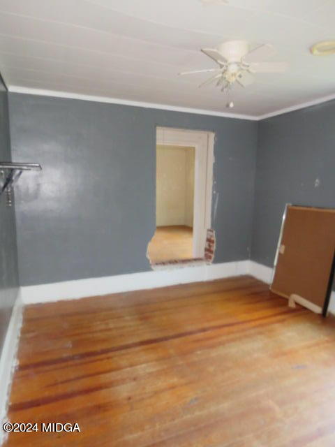 7367 Columbus Road Lizella, GA 31052 - Photo 9 of 12 a view of an empty room with wooden floor and a window