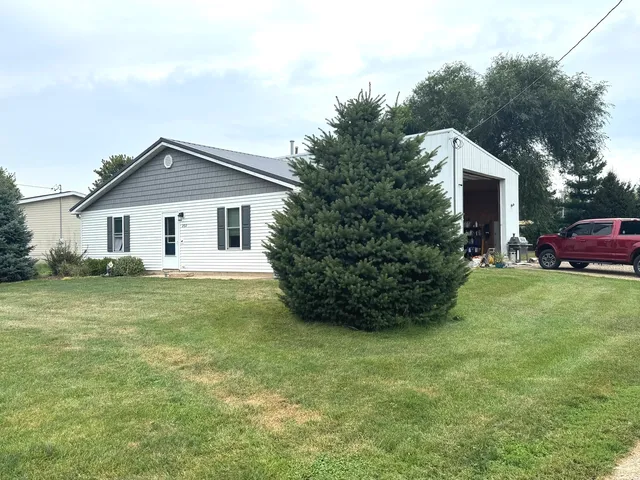 a front view of house with yard and green space