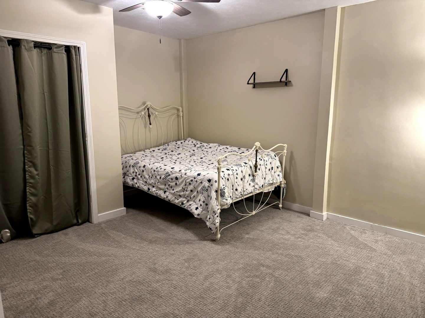 202 Front Street Malden, IL 61337 - Photo 15 of 17 a bed sitting in a bedroom next to a bathroom