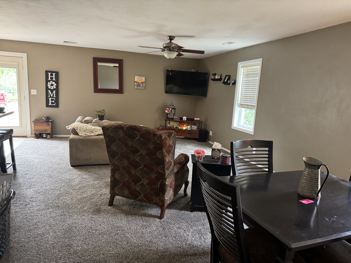 202 Front Street Malden, IL 61337 - Photo 8 of 17 a living room with furniture a flat screen tv and a window