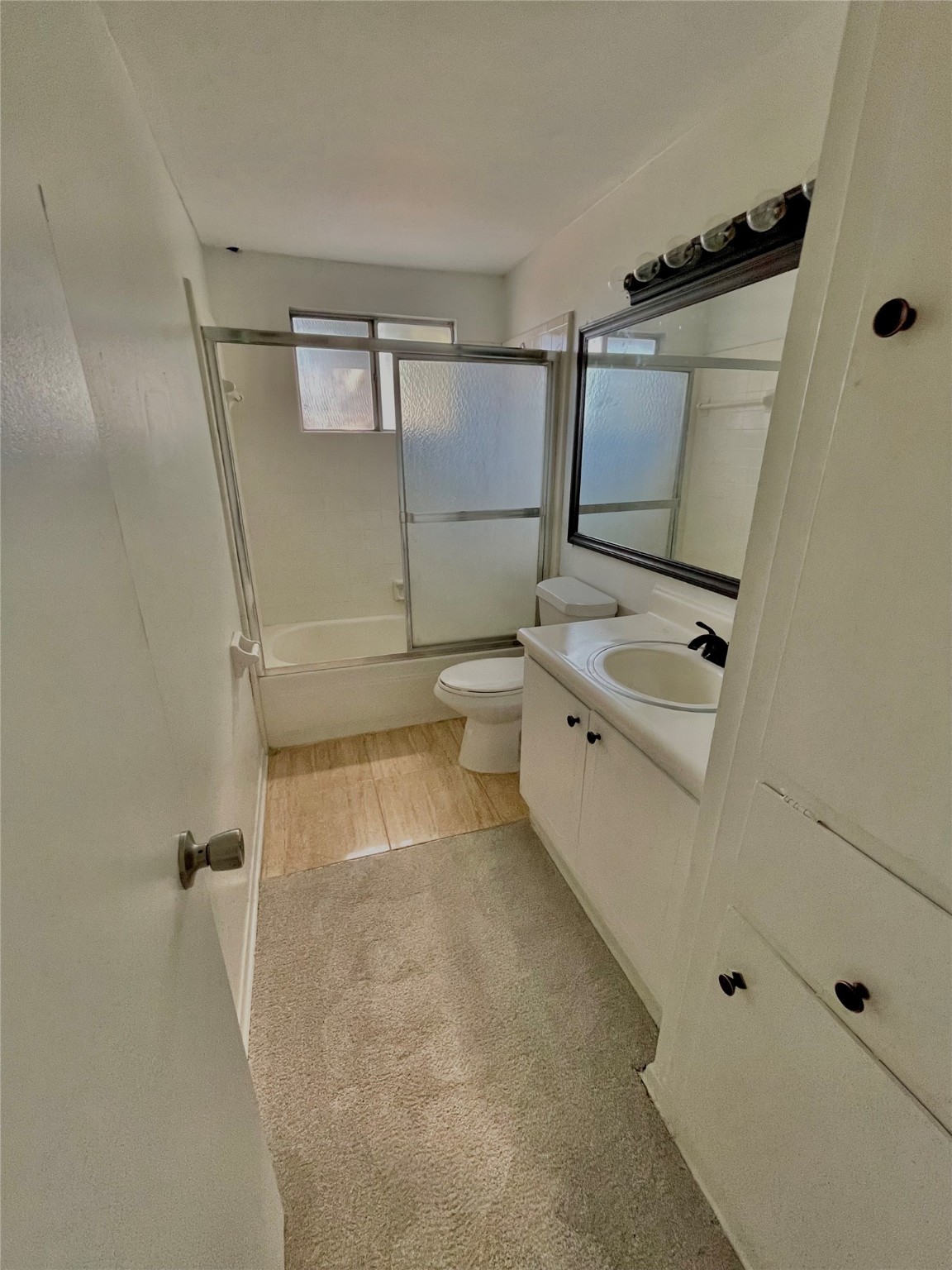 11606 Sagehurst Lane Houston, TX 77089 - Photo 12 of 13 a bathroom with a tub sink a mirror and shower