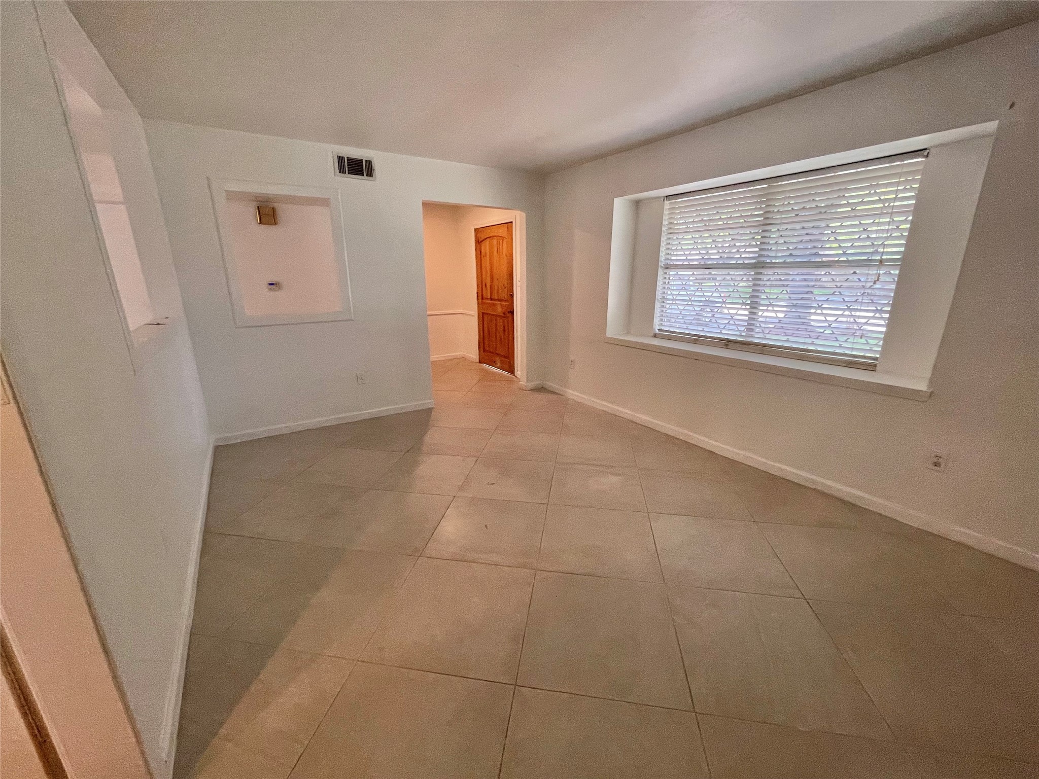 11606 Sagehurst Lane Houston, TX 77089 - Photo 2 of 13 a view of an empty room with a window