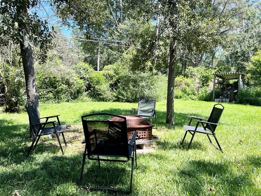 2240 Northwest 14th Avenue Gainesville, FL 32605 - Photo 12 of 13 a view of chair and table in the garden