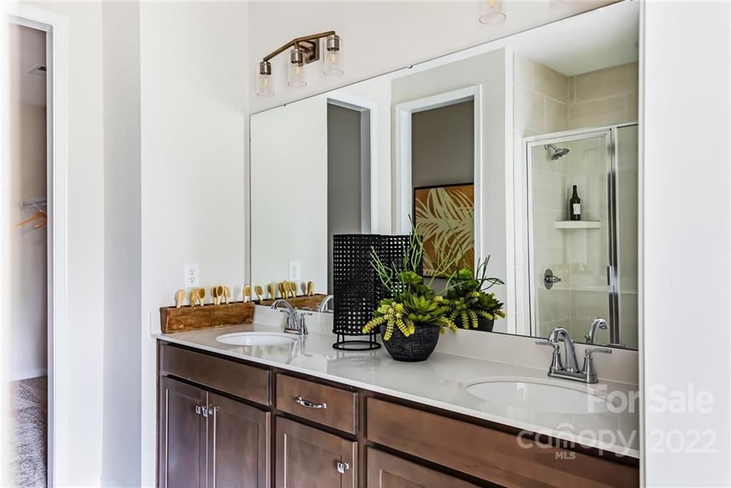 517 Madison Falls Court Fort Mill, SC 29708 - Photo 15 of 22 a bathroom with a granite countertop sink and a mirror