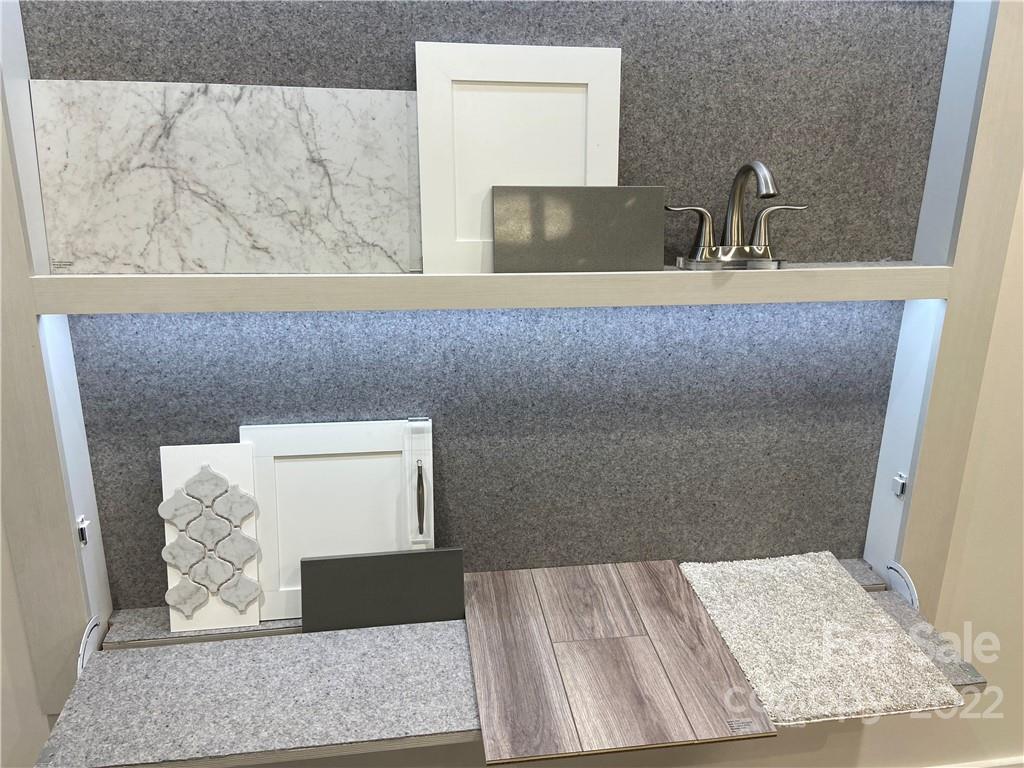 517 Madison Falls Court Fort Mill, SC 29708 - Photo 2 of 22 a bathroom with a sink and a mirror