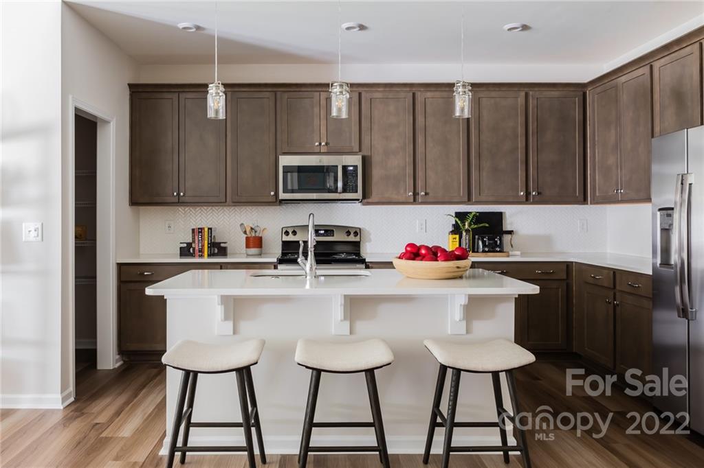 517 Madison Falls Court Fort Mill, SC 29708 - Photo 7 of 22 a kitchen with a sink cabinets and microwave