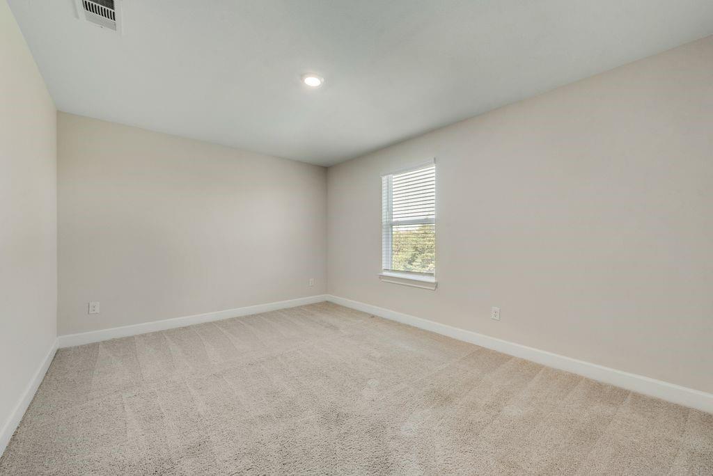 1421 Butler Avenue Princeton, TX 75407 - Photo 13 of 25 an empty room with a window