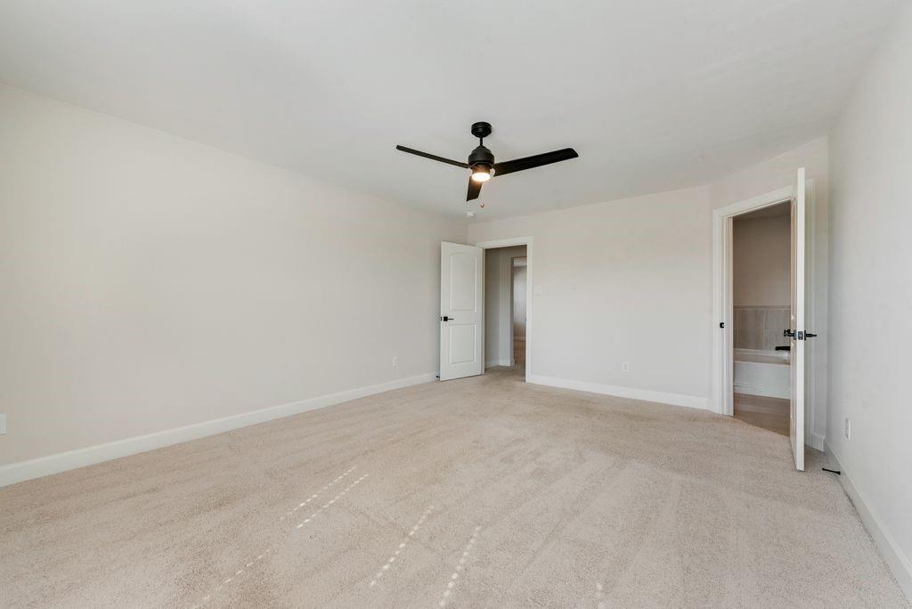 1421 Butler Avenue Princeton, TX 75407 - Photo 19 of 25 a view of a livingroom with a ceiling fan and window