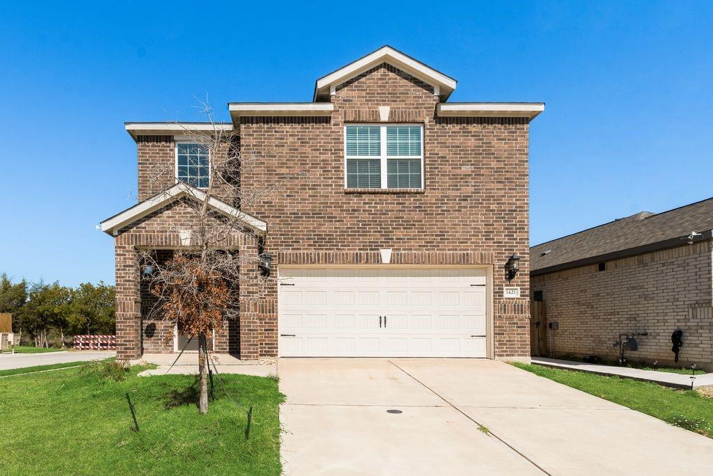 1421 Butler Avenue Princeton, TX 75407 - Photo 4 of 25 a front view of a house with a yard