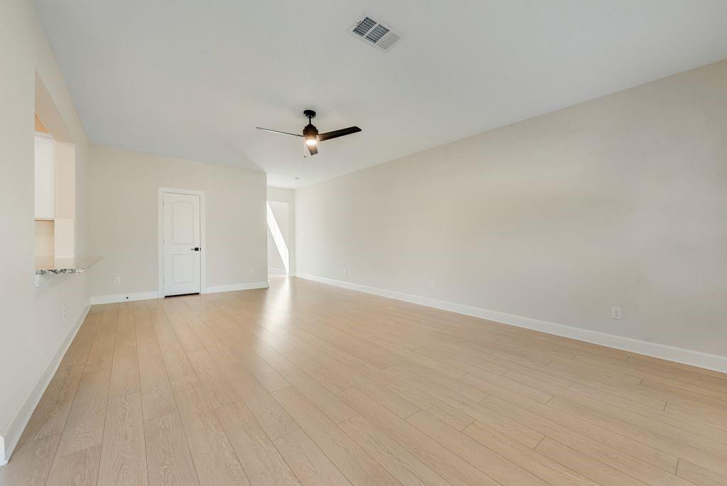 1421 Butler Avenue Princeton, TX 75407 - Photo 8 of 25 wooden floor in an empty room