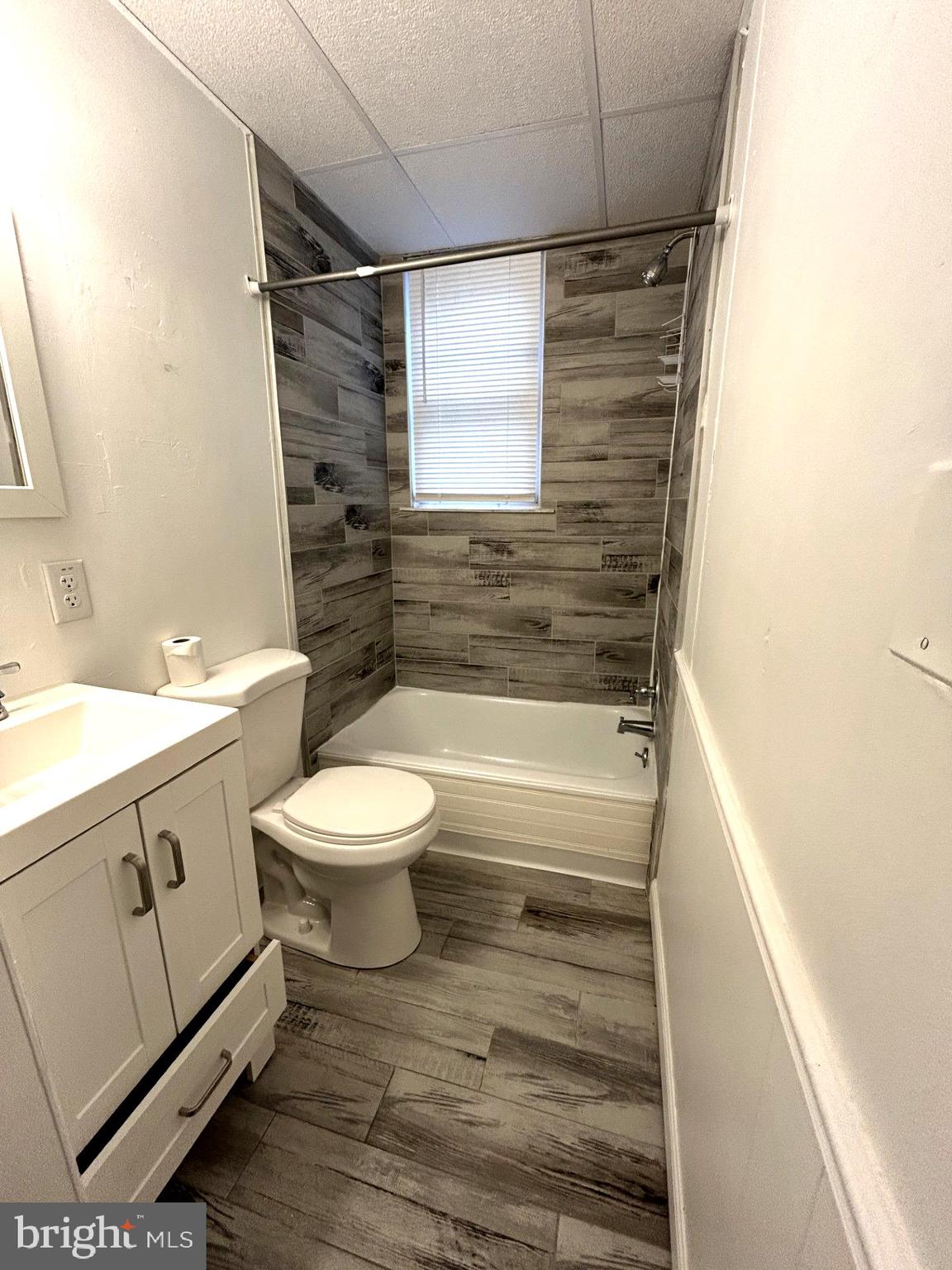 435 Radcliffe Street, Unit 13 Bristol, PA 19007 - Photo 2 of 8 a bathroom with a sink toilet and shower