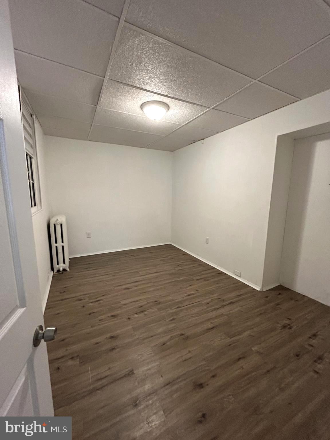 435 Radcliffe Street, Unit 13 Bristol, PA 19007 - Photo 7 of 8 an empty room with wooden floor