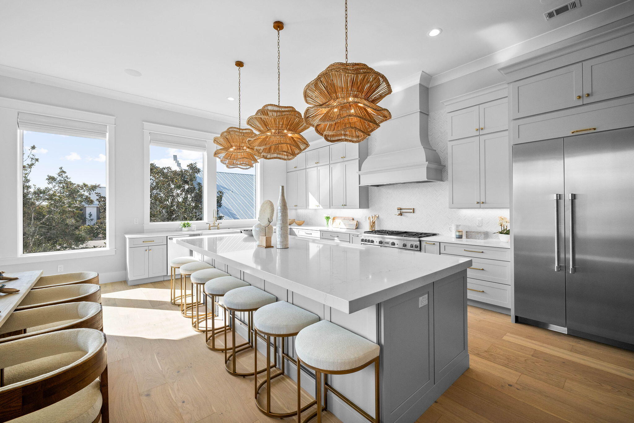 54 Marthas Lane Santa Rosa Beach, FL 32459 - Photo 23 of 59 a kitchen with stainless steel appliances granite countertop a sink a stove and a dining table with wooden floor