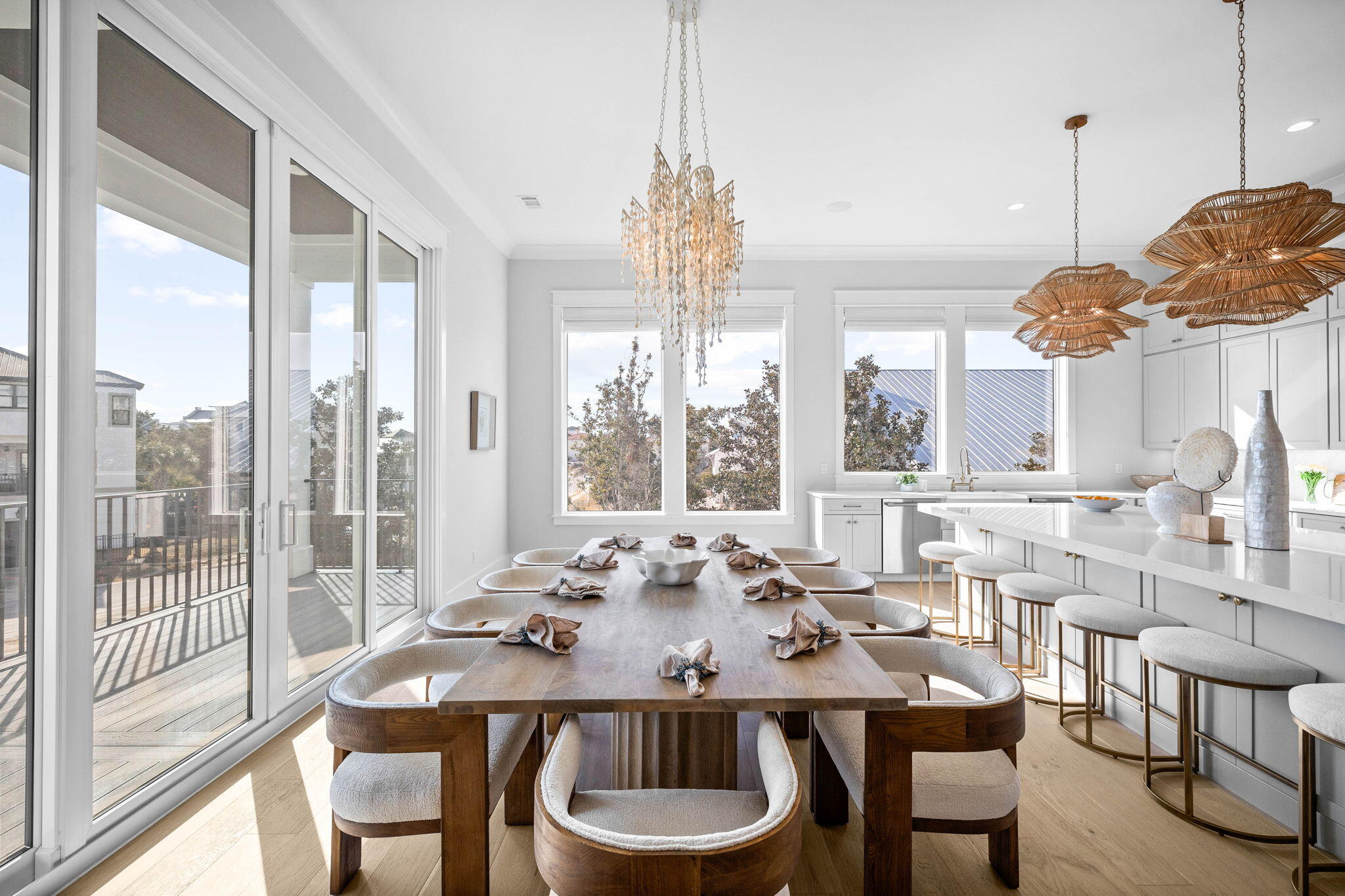 54 Marthas Lane Santa Rosa Beach, FL 32459 - Photo 27 of 59 a view of a dining room with furniture large windows and wooden floor