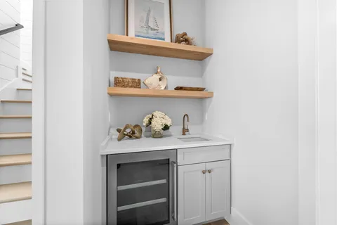 a spacious bedroom with a bed and a flat screen tv