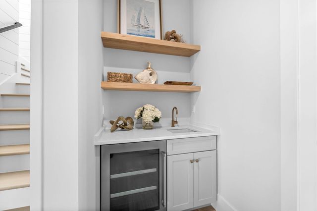 a spacious bedroom with a bed and a flat screen tv