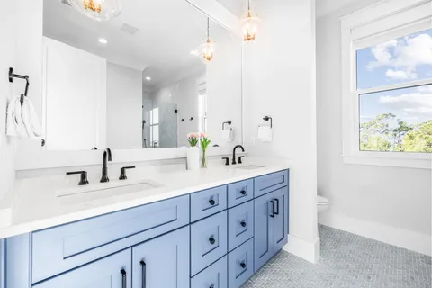 a outdoor sitting area with furniture and a garden view