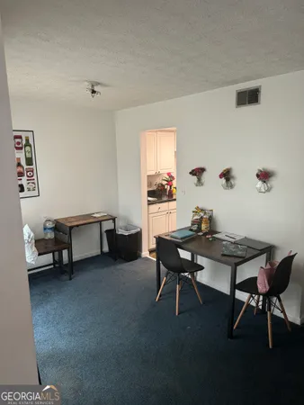 a view of a workspace with furniture and a couch