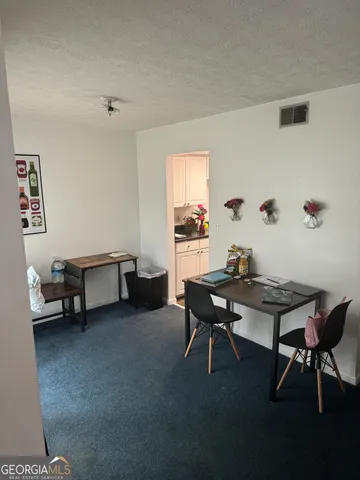 a view of a workspace with furniture and a couch