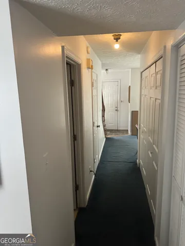 a view of entryway and workspace