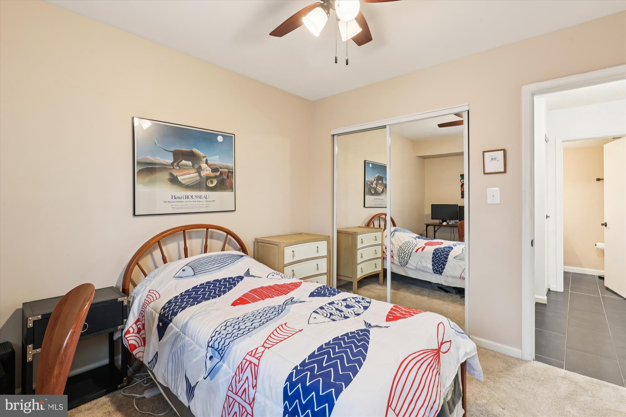 5802 Cove Landing Road, Unit 101 Burke, VA 22015 - Photo 21 of 35 a bedroom with bed and a chandelier
