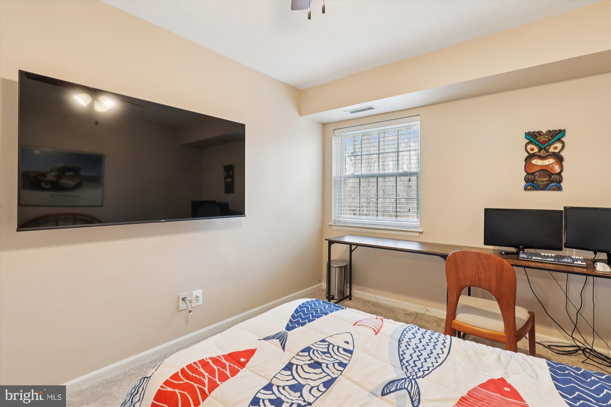 5802 Cove Landing Road, Unit 101 Burke, VA 22015 - Photo 22 of 35 a bedroom with a bed and a flat screen tv